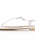 Silver sandal with knotted laces on a white background. Size 12.